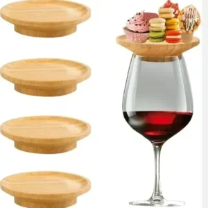 Wooden trays on wine glass with desserts.