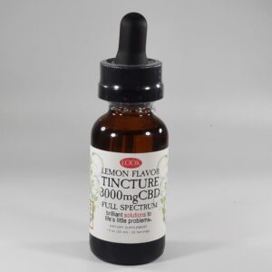 A bottle of CBD tincture with dropper cap on a plain background.
