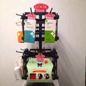 Display stand with colorful gift bags and boxes for sale.