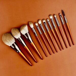 Set of orange-handled makeup brushes